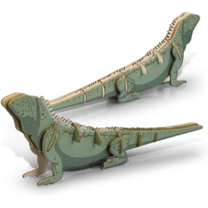 A green and natural wooden model of a tuatara, featuring intricate cut-out details and a creative design.