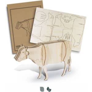 A wooden cow model in natural wood colour, accompanied by assembly sheets. The model features a simple design with a logo.