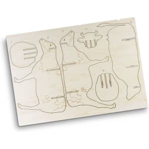 A wooden model kit featuring components to assemble a cow, with engraved outlines for easy assembly.