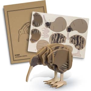 A wooden model kit of a kiwi bird in brown tones, alongside a cardboard backing with cut-out pieces and assembly instructions.
