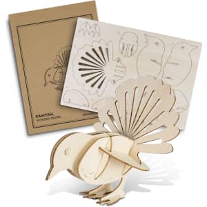 A wooden model of a fantail bird in natural wood tones, with a detailed assembly sheet. Includes a logo.