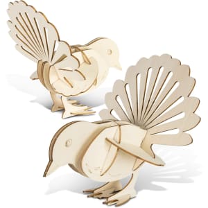 A wooden model of a fantail bird in natural colour, featuring intricate cut-out detailing and a three-dimensional design.