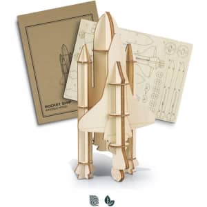 A wooden rocket ship model in natural wood colour, accompanied by assembly instructions and parts sheets.