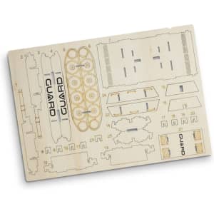 A wooden model kit featuring pre-cut pieces for assembly, showing various shapes and components in a light wood finish.