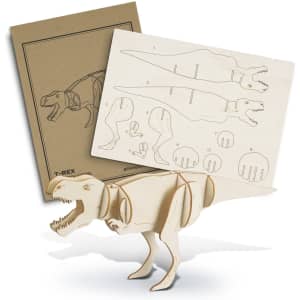 A wooden model of a Tyrannosaurus Rex in natural wood colour, accompanied by assembly instructions on a brown card.