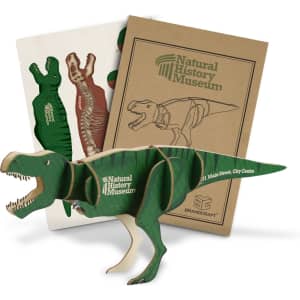 A green wooden Tyrannosaurus Rex model with anatomical pieces and packaging from the Natural History Museum.