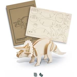 A wooden triceratops model in natural wood, alongside pre-cut pieces for assembly and a branded instruction sheet.
