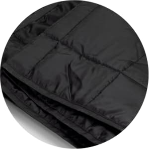 A black puffer blanket with a quilted texture, featuring a smooth, shiny surface and folds. Includes branding.