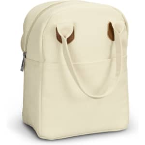 A cream-coloured lunch bag with brown leather handles, featuring a zippered opening and a front pocket.