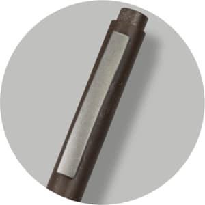 A dark grey pen featuring a smooth barrel and a metallic accent, with a logo present on the barrel.