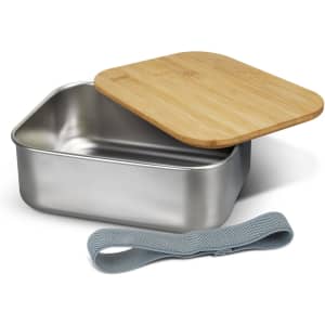 A stainless steel lunch box with a bamboo lid and a grey elastic strap, featuring a sleek design.