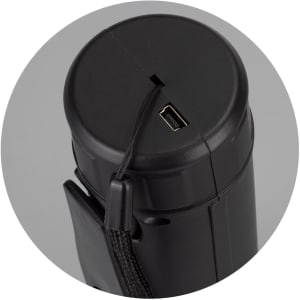 A black rechargeable torch with a charging port on the top and a strap for easy carrying.