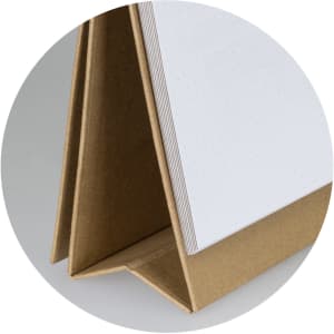 A desk whiteboard notebook featuring a brown cover and blank dotted pages, standing upright for easy access.