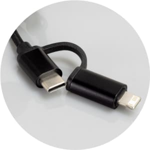 A braided charging cable in black, featuring USB-C and Lightning connectors, with a logo on one side.