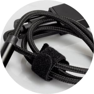 A braided charging cable in black, featuring a velcro tie for organisation and a connector at the end.