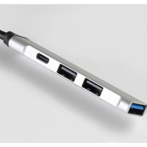 A silver USB hub with multiple ports, including USB-A and USB-C, on a white background.
