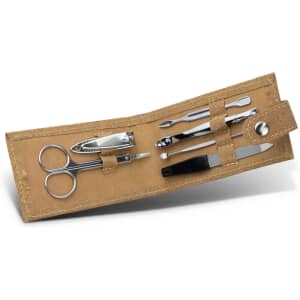 A cork manicure set featuring stainless steel tools, including scissors, clippers, and a cuticle pusher, in a natural cork case.