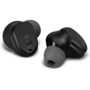 Two Skullcandy Mod TWS earbuds in black with green silicone tips, featuring a logo on one earbud.