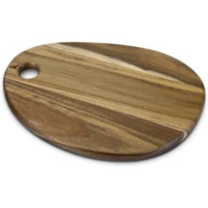 A wooden serving board in natural tones, featuring a rounded edge and a small hole for easy handling.