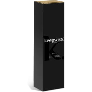 A tall black box containing a Keepsake Pepper Mill, featuring a logo and minimalistic design.