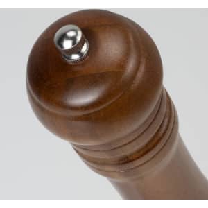 A wooden pepper mill with a polished finish and metallic adjustment knob on top.