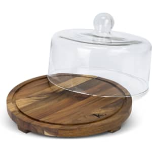 A wooden cake display stand with a glass dome lid, featuring a circular base and a smooth finish.