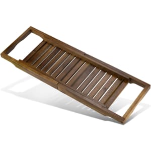 A wooden bath caddy in a dark brown finish with slatted design and handles on each side.