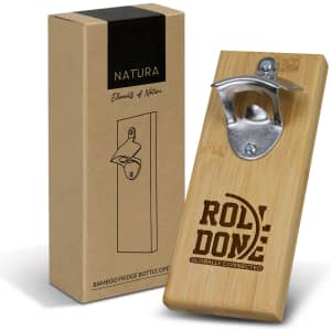 A drink bottle opener made from bamboo with a metal cap remover, displayed next to a cardboard box featuring a logo.