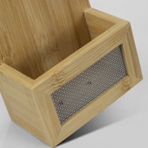 A drink bottle opener made of natural bamboo with a metal mesh section, featuring a simple and stylish design.