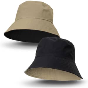 A reversible bucket hat featuring a beige side and a black side, with a logo on one side.