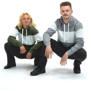 Unisex hoodie in grey and green with a colour-block design, featuring a logo and drawstring hood.
