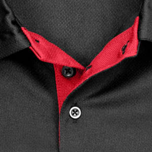 A black polo shirt featuring a red collar and button placket, with a logo on the fabric.