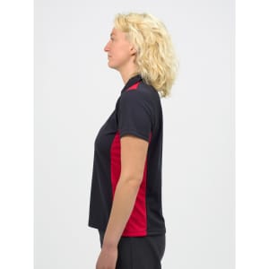 A women's polo shirt in black with red accents, featuring a collar and a side view of the model.