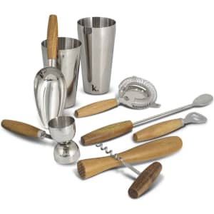 A cocktail set featuring stainless steel tools and wooden handles, including shakers, a jigger, and a strainer.