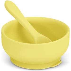 A yellow suction bowl set with a matching spoon, made from silicone material. Lightweight and easy to clean.