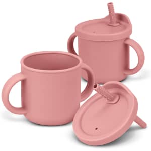 A drink bottle in soft pink, featuring two cups with handles and removable lids, each with a spout.