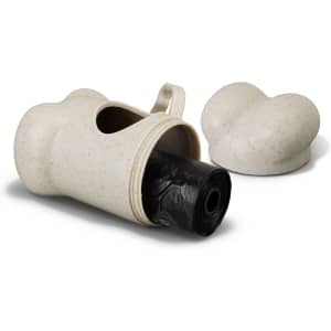 A natural-coloured pet bag dispenser with a rounded design, featuring a roll of black bags inside and a removable lid.