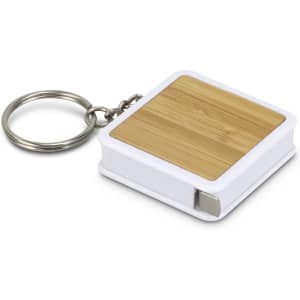 A bamboo tape measure key ring with a white casing and a metal key ring attachment.