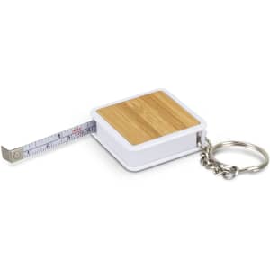 A bamboo-topped tape measure with a silver key ring and a white casing. The tape is retractable.
