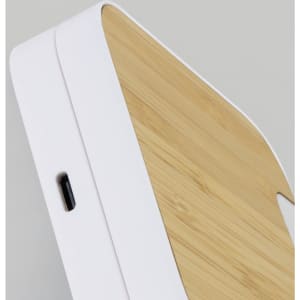A wireless fast charging stand featuring a white base and a bamboo top, with a USB-C port.