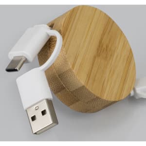 A bamboo retractable charging cable with white connectors, featuring a circular bamboo casing.