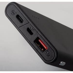 A black power bank with USB-C and USB-A ports, featuring a minimalist design and a small logo.
