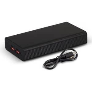 A black power bank with two output ports and a USB charging cable beside it.