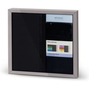 A Moleskine bundle featuring a black sketchbook and a set of 12 watercolour pencils, presented in a sleek frame.