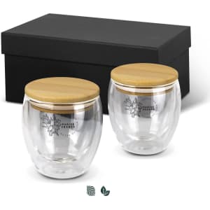 A drink bottle set featuring two clear glass cups with bamboo lids, presented in a black gift box.