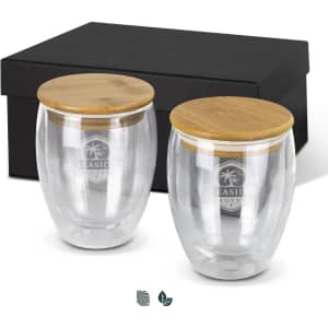 A drink bottle set featuring two clear glass cups with bamboo lids, presented in a black box.