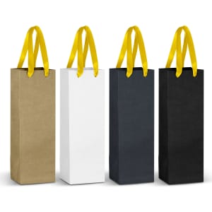 Four tall paper bags in gold, white, black, and dark grey, each featuring yellow ribbon handles. They have branding logos.