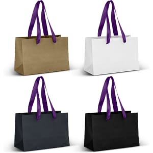 A set of small ribbon handle paper bags in gold, white, and black with purple handles. Each bag has a logo.