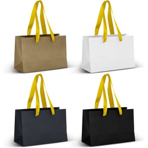 Small ribbon handle paper bags in gold, white, navy, and black, each with yellow handles.