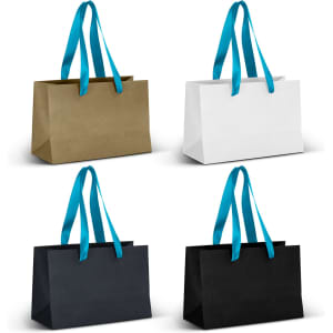 Four small ribbon handle paper bags in gold, white, black, and blue with bright blue handles. Each bag has a logo.